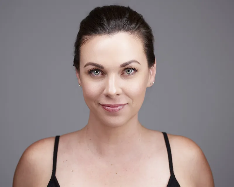 Beauty headshot with hair pulled back showing full facial features jawline and bone structure for modeling portfolio